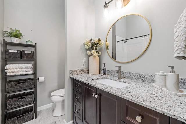 1715 Livingston Ave Unit A, West Saint Paul, MN 55118 - full bathroom with vanity, toilet, baseboards, and a shower with curtain