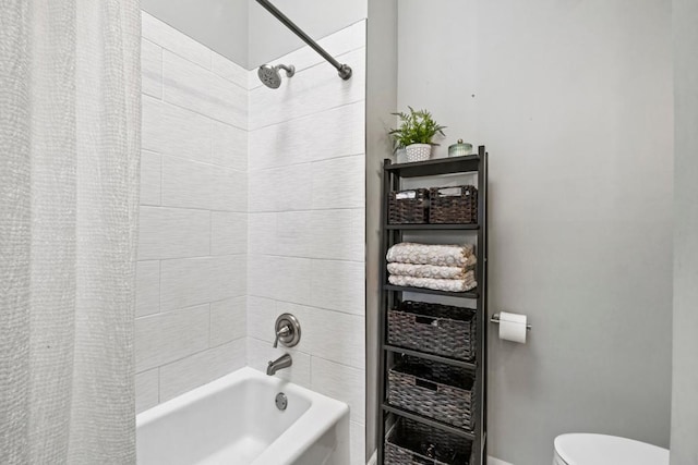 1715 Livingston Ave Unit A, West Saint Paul, MN 55118 - bathroom featuring shower / tub combo, toilet, and baseboards