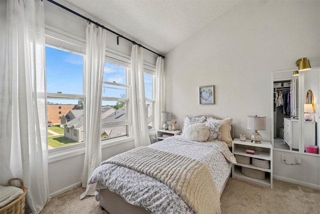 1715 Livingston Ave Unit A, West Saint Paul, MN 55118 - bedroom featuring carpet floors, vaulted ceiling, a textured ceiling, and baseboards