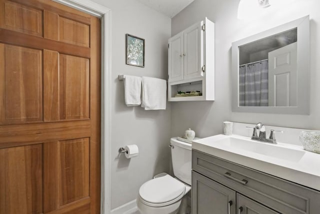 1715 Livingston Ave Unit A, West Saint Paul, MN 55118 - bathroom featuring vanity, toilet, and baseboards