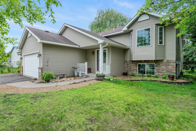 903 3rd Ave SW, Isanti, MN 55040 - tri-level home with an attached garage, a front lawn, brick siding, and asphalt driveway