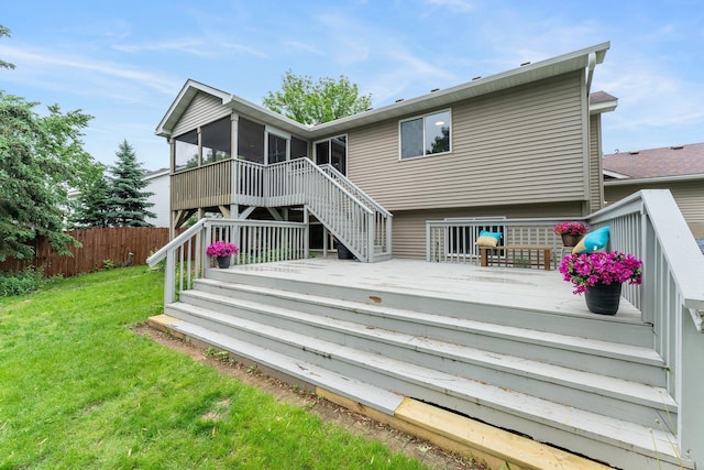 903 3rd Ave SW, Isanti, MN 55040 - rear view of house with stairs, a sunroom, and a deck