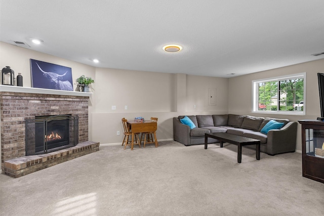 903 3rd Ave SW, Isanti, MN 55040 - living room with carpet flooring, a brick fireplace, baseboards, and recessed lighting
