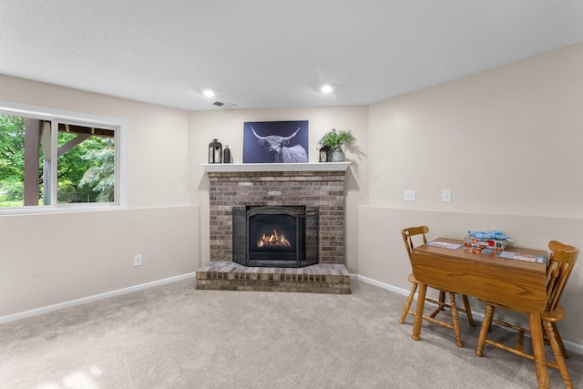903 3rd Ave SW, Isanti, MN 55040 - living area featuring a fireplace, carpet flooring, baseboards, and recessed lighting