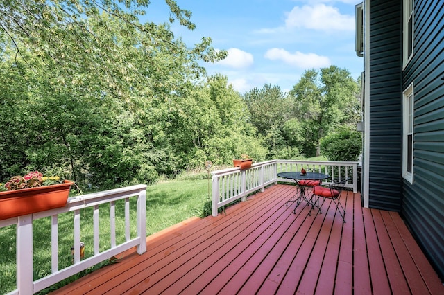 2333 Grange Ave N, Oakdale, MN 55128 - wooden deck featuring a lawn and outdoor dining area