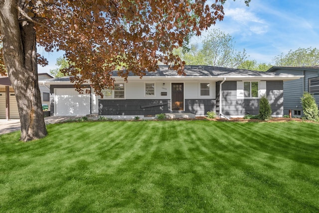 1805 Melrose Ave, Saint Louis Park, MN 55426 - rear view of house featuring a garage and a lawn