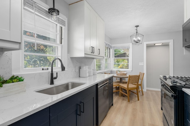 1805 Melrose Ave, Saint Louis Park, MN 55426 - kitchen featuring black range with electric cooktop, stainless steel dishwasher, a sink, white cabinets, and light wood-style floors