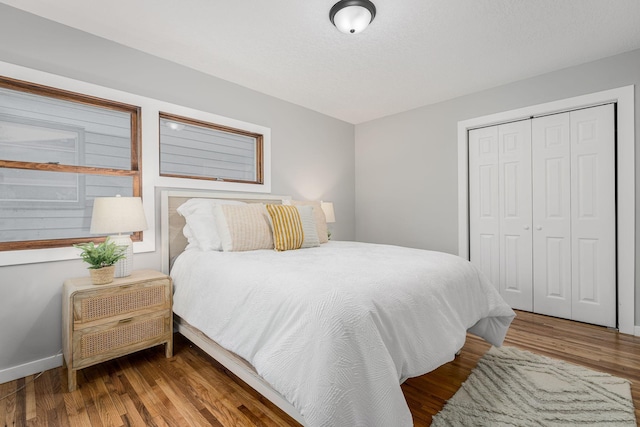 1805 Melrose Ave, Saint Louis Park, MN 55426 - bedroom with a closet, wood finished floors, and baseboards