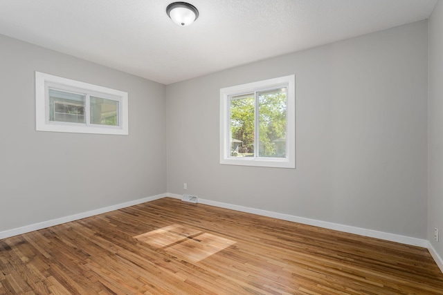 1805 Melrose Ave, Saint Louis Park, MN 55426 - empty room with baseboards and light wood-style flooring