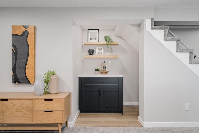 1805 Melrose Ave, Saint Louis Park, MN 55426 - indoor dry bar with baseboards, stairs, and light wood-type flooring