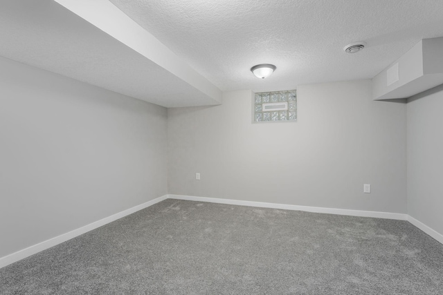 1805 Melrose Ave, Saint Louis Park, MN 55426 - finished below grade area featuring dark colored carpet, baseboards, and a textured ceiling