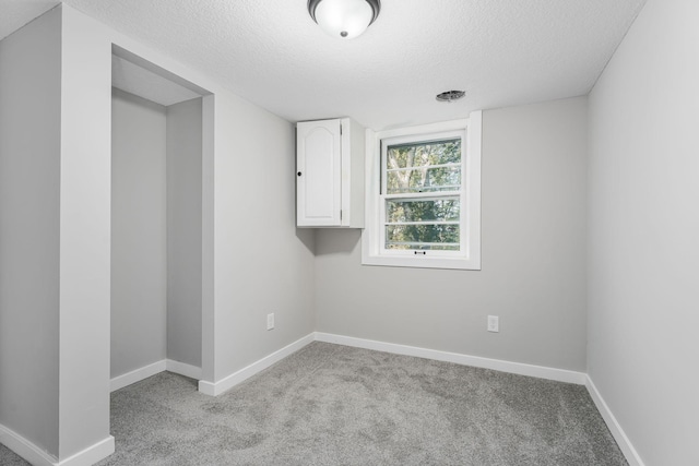 1805 Melrose Ave, Saint Louis Park, MN 55426 - empty room featuring a textured ceiling, light colored carpet, and baseboards