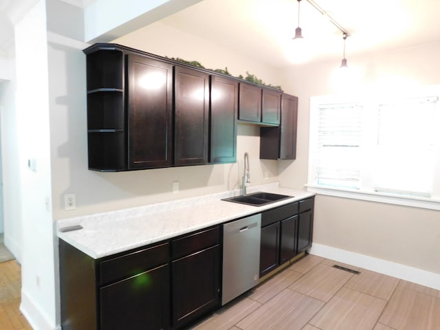 kitchen featuring stainless steel dishwasher, a sink, open shelves, dark brown cabinetry, and light countertops