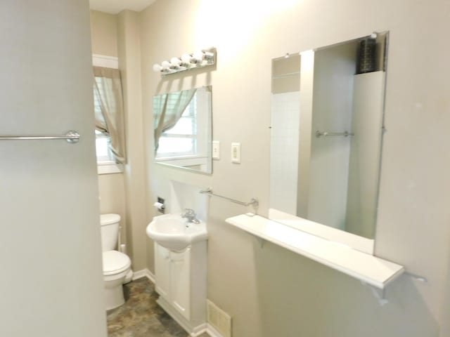 full bath with toilet and a sink