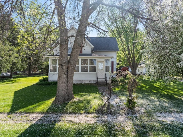 37726 2nd Ave, Dennison, MN 55018 - view of front facade with a sunroom, a front lawn, and crawl space