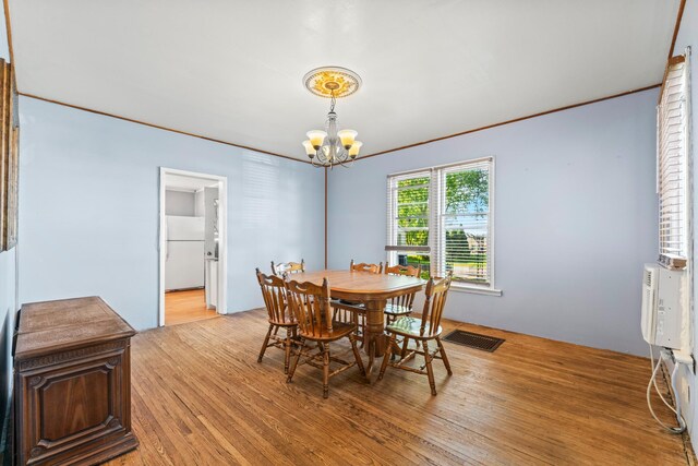 37726 2nd Ave, Dennison, MN 55018 - dining space featuring a chandelier and light wood-type flooring