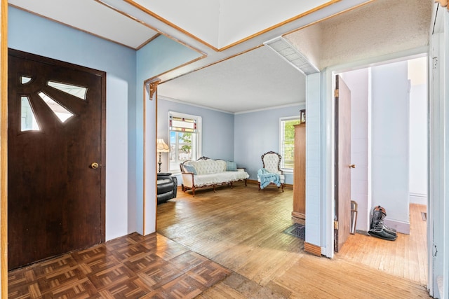 37726 2nd Ave, Dennison, MN 55018 - entryway featuring ornamental molding, parquet floors, and baseboards