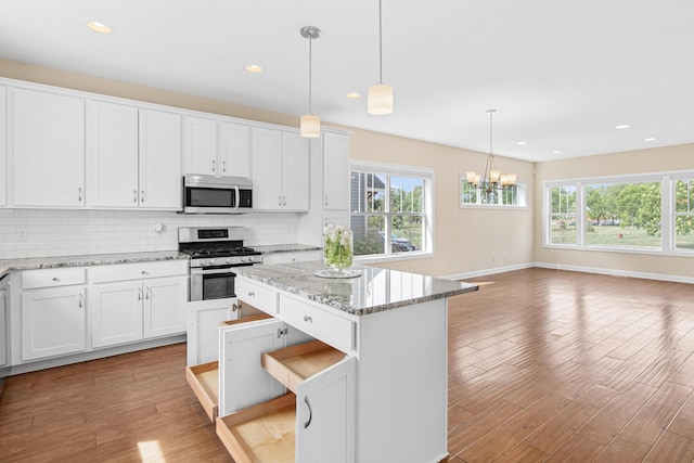 5024 Humboldt Ln N, Minneapolis, MN 55430 - kitchen with appliances with stainless steel finishes, healthy amount of natural light, light wood-style floors, decorative backsplash, and recessed lighting