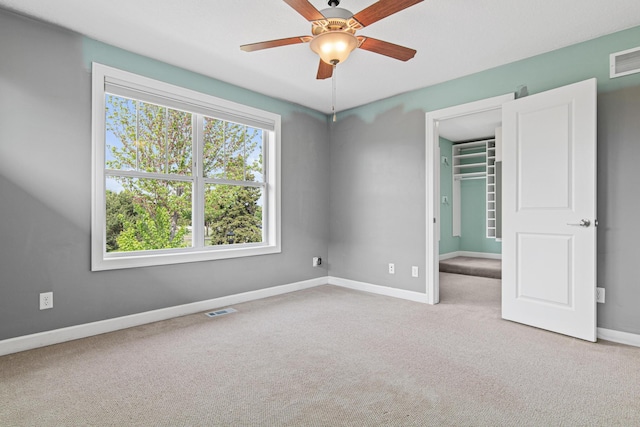 5024 Humboldt Ln N, Minneapolis, MN 55430 - unfurnished bedroom featuring carpet flooring, baseboards, a spacious closet, a closet, and ceiling fan