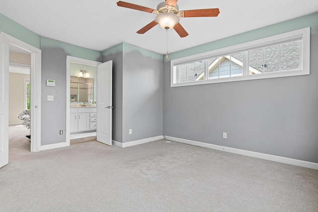 5024 Humboldt Ln N, Minneapolis, MN 55430 - unfurnished bedroom featuring carpet flooring, baseboards, a ceiling fan, and ensuite bath