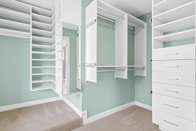 5024 Humboldt Ln N, Minneapolis, MN 55430 - walk in closet featuring carpet floors