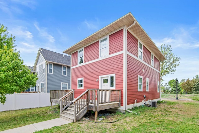 5024 Humboldt Ln N, Minneapolis, MN 55430 - rear view of property with a wooden deck and central AC unit