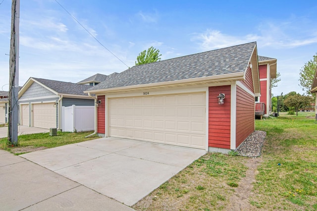 5024 Humboldt Ln N, Minneapolis, MN 55430 - view of front of property with a garage and roof with shingles