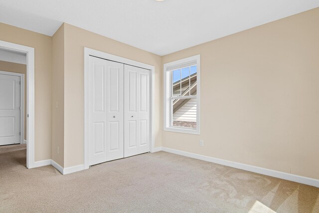 5024 Humboldt Ln N, Minneapolis, MN 55430 - unfurnished bedroom with carpet, baseboards, and a closet
