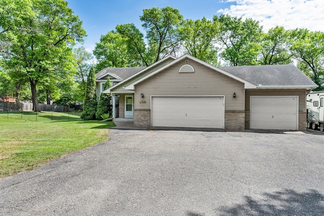 2308 Crosstown Blvd NE, Ham Lake, MN 55304 - view of front facade with brick siding, asphalt driveway, a shingled roof, and an attached garage