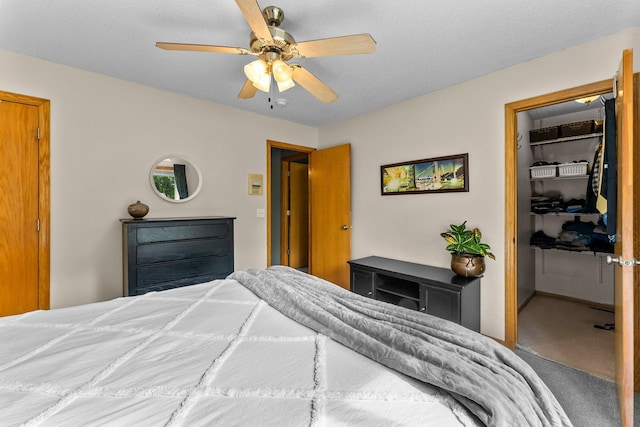 2308 Crosstown Blvd NE, Ham Lake, MN 55304 - carpeted bedroom featuring a closet, a spacious closet, and a ceiling fan