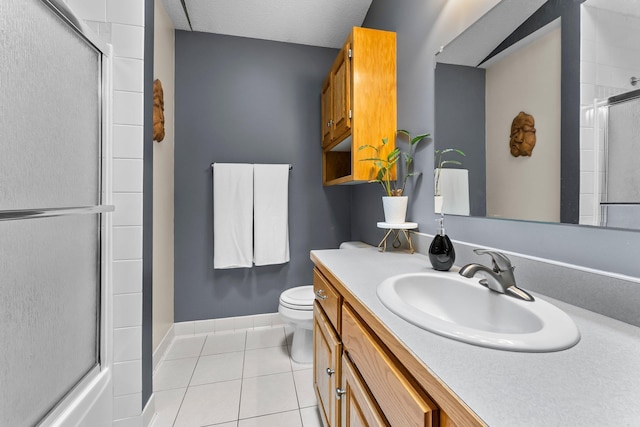 2308 Crosstown Blvd NE, Ham Lake, MN 55304 - full bathroom featuring an enclosed shower, tile patterned flooring, and toilet