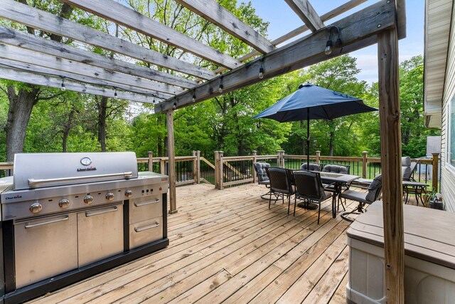 2308 Crosstown Blvd NE, Ham Lake, MN 55304 - wooden deck with outdoor dining space and a pergola