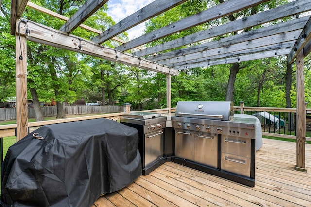 2308 Crosstown Blvd NE, Ham Lake, MN 55304 - wooden terrace with a fenced backyard, a pergola, and view of scattered trees
