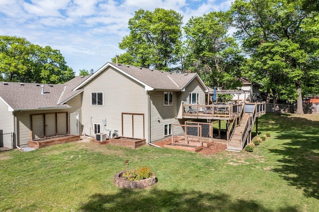 2308 Crosstown Blvd NE, Ham Lake, MN 55304 - rear view of house featuring a deck, central air condition unit, and a shingled roof