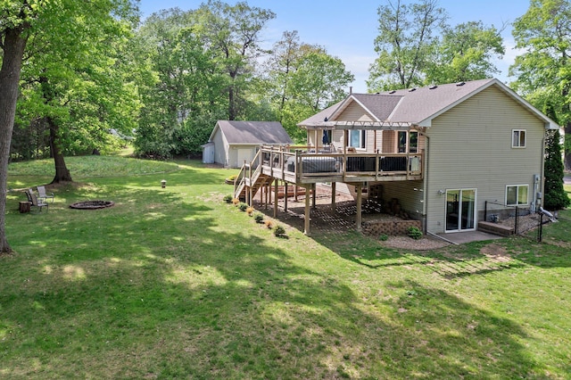 2308 Crosstown Blvd NE, Ham Lake, MN 55304 - rear view of property with a deck, an outdoor fire pit, a yard, an outdoor structure, and stairway