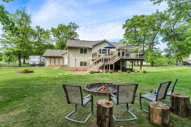 2308 Crosstown Blvd NE, Ham Lake, MN 55304 - back of house featuring an outdoor fire pit, a wooden deck, and stairs