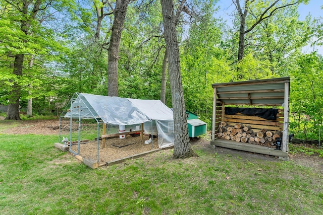 2308 Crosstown Blvd NE, Ham Lake, MN 55304 - view of grassy yard featuring exterior structure and an outbuilding