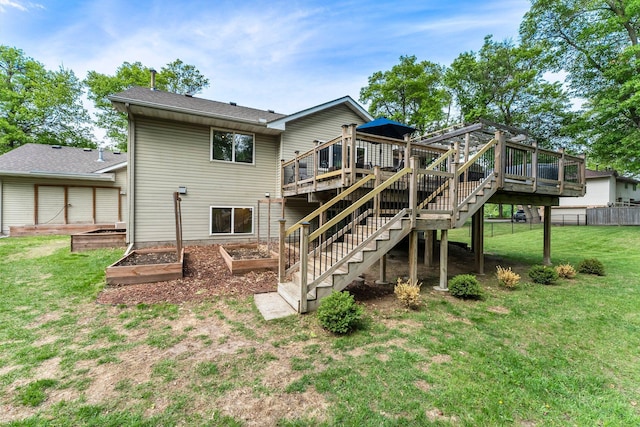 2308 Crosstown Blvd NE, Ham Lake, MN 55304 - rear view of property with a deck, a garden, and stairs