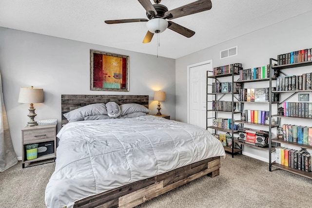 1963 Bluestem Ln, Shoreview, MN 55126 - bedroom featuring carpet, a textured ceiling, and a ceiling fan