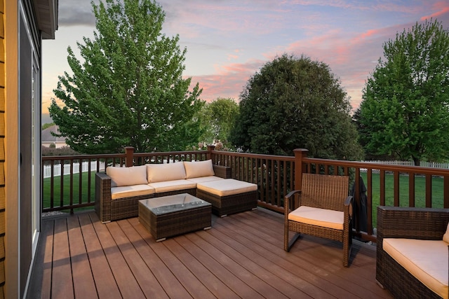 wooden terrace with an outdoor hangout area and a yard