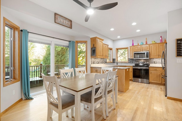 dining space featuring ceiling fan, light wood finished floors, baseboards, and recessed lighting
