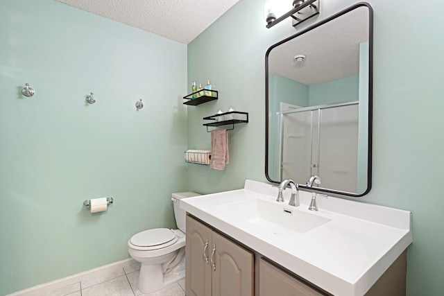 full bathroom with a textured ceiling, a shower stall, tile patterned flooring, toilet, and vanity