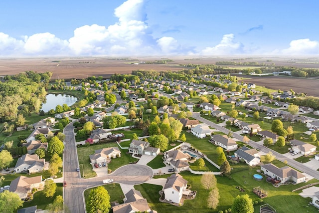 aerial overview of property's location featuring nearby suburban area and a nearby body of water