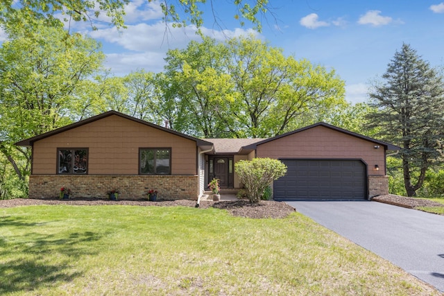 1588 Chatham Ave, Arden Hills, MN 55112 - view of front of house with a garage, brick siding, asphalt driveway, and a front yard