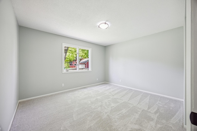 1588 Chatham Ave, Arden Hills, MN 55112 - unfurnished room featuring carpet, baseboards, and a textured ceiling