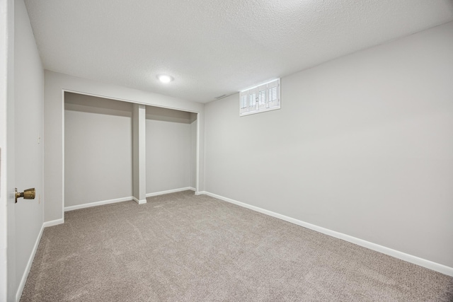 1588 Chatham Ave, Arden Hills, MN 55112 - basement with carpet floors, a textured ceiling, and baseboards