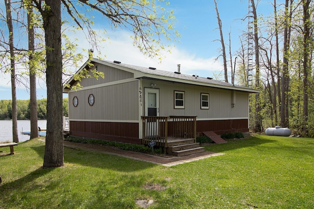 7528 Little Thunder Dr NE, Remer, MN 56672 - rear view of property featuring a lawn