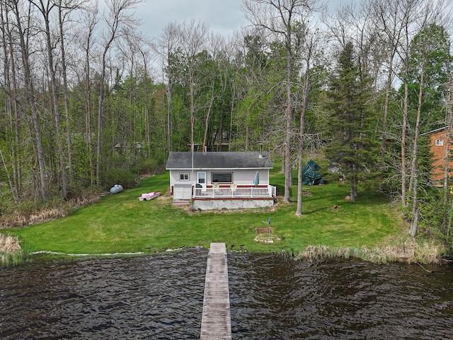 7528 Little Thunder Dr NE, Remer, MN 56672 - dock area with a deck with water view, a lawn, and a view of trees
