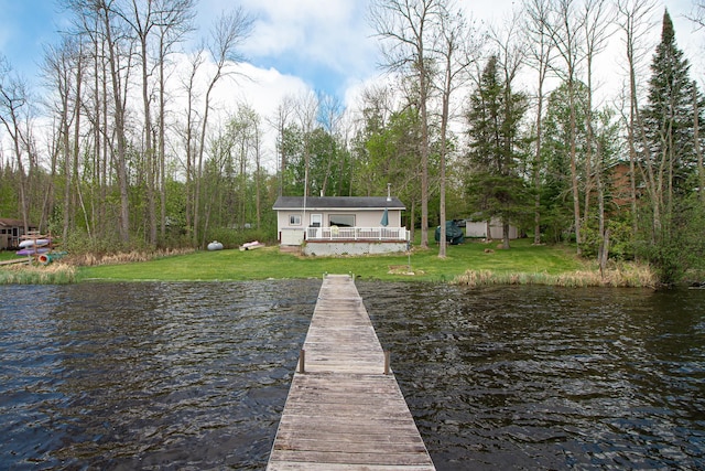 7528 Little Thunder Dr NE, Remer, MN 56672 - dock area featuring a lawn and a deck with water view