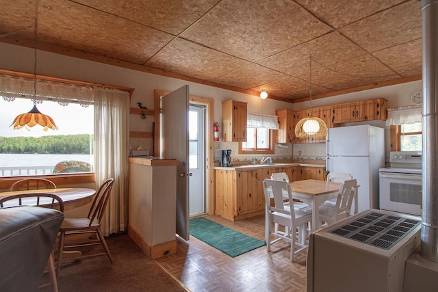 7528 Little Thunder Dr NE, Remer, MN 56672 - kitchen with white appliances, light countertops, pendant lighting, and a sink